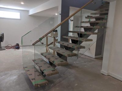 Frameless Glass With Handrail on Wooden Steps